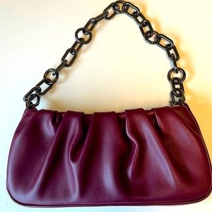 Small purse with‎ chain strap. Beautiful maroon color. In perfect shape.